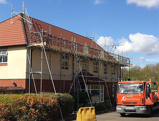 A scaffolder carries out safety checks
