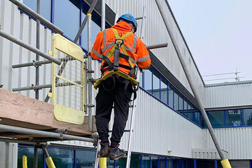 A scaffolder carries out safety checks